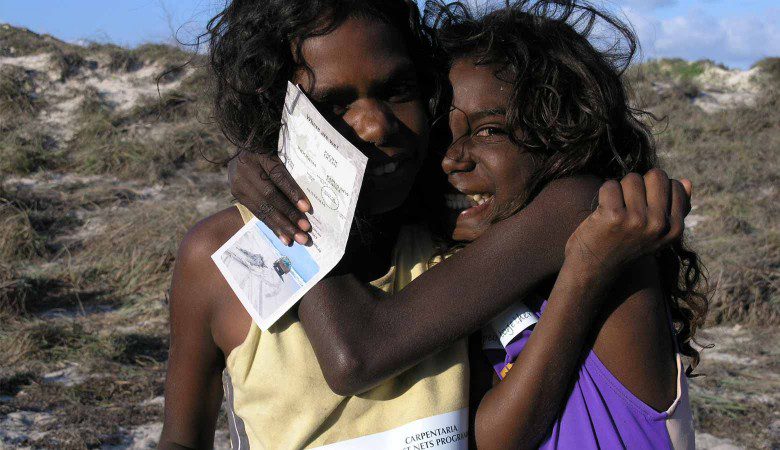 These two girls from Nhulunbuy, NT are proudly supporting the ghost net program. Photo by Jane Dermer.